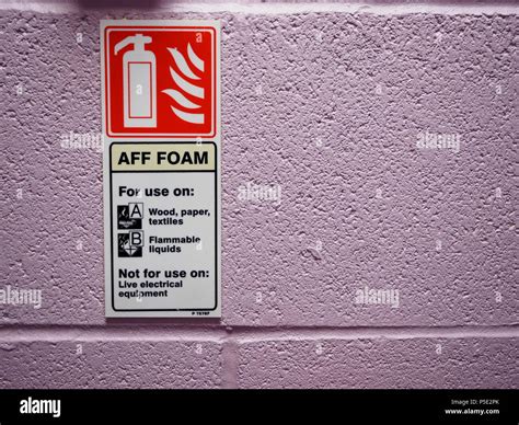 Aff Foam Spray Fire Extinguisher Sign On A Purple Brick Wall Stock