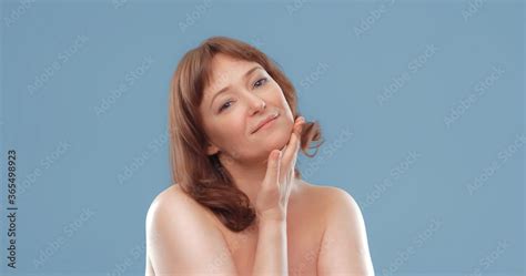 Happy Mature Woman Applies Skin Care Cream Touching Face With Hand Nude Woman Applying Anti Age