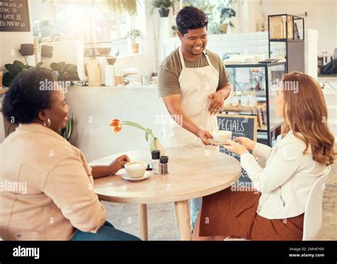 Waiter Serving And Restaurant Service For Customer At A Coffee Shop Or