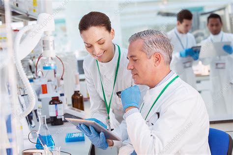 Scientists Using Tablet Computer Stock Image F014 9620 Science