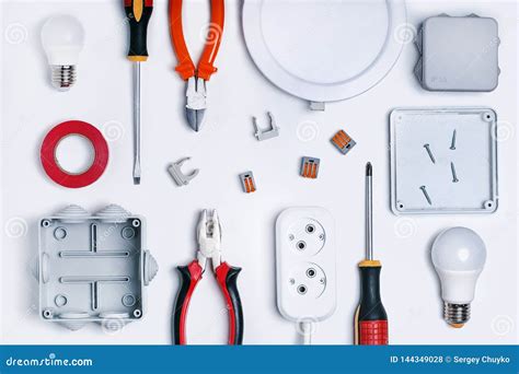 Different Electrical Tools On Light Grey Background Top View Stock