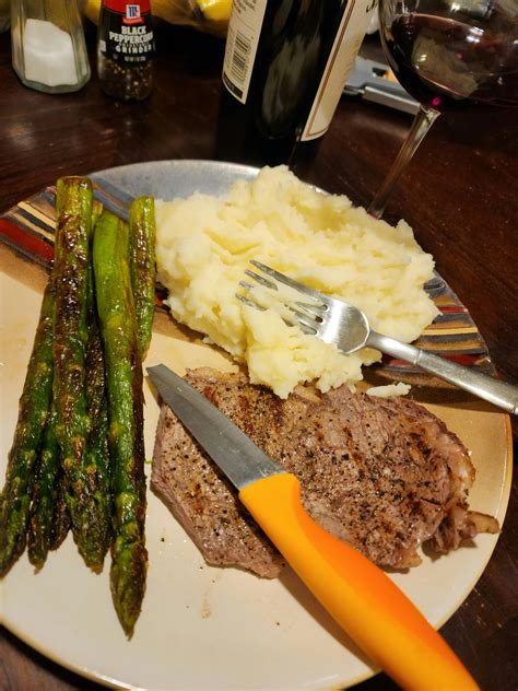 Thin ribeye, with mashed potatoes and asparagus. And red wine : r/dinner