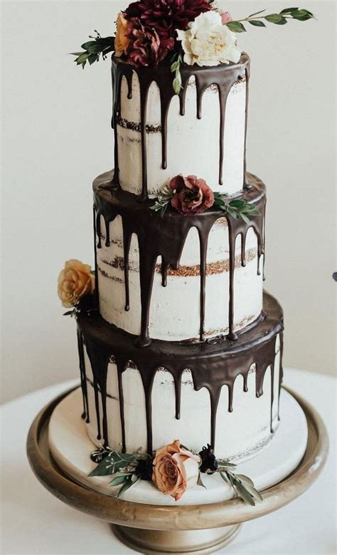 A Fantastic Three Tier Naked Wedding Cake With Chocolate Drip Blooms