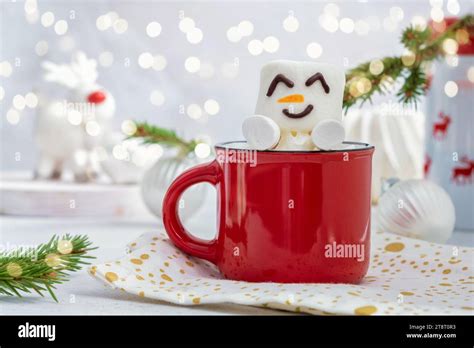 Red Mug With Hot Chocolate With Melted Marshmallow Snowman Christmas Card Stock Photo Alamy