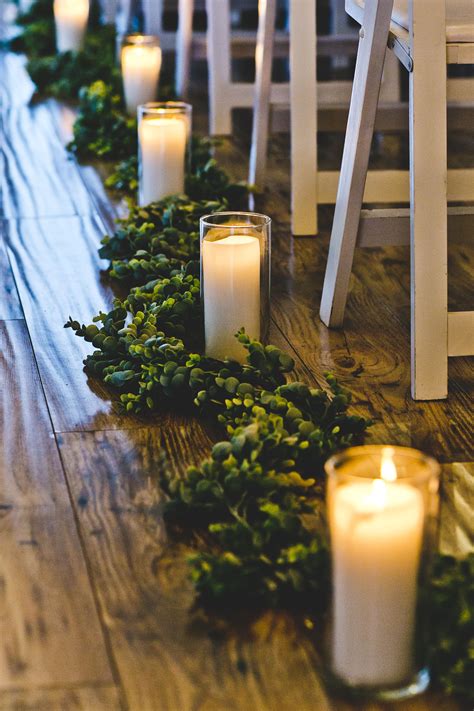 Greenery And Candles Down The Aisle Candle Wedding Centerpieces