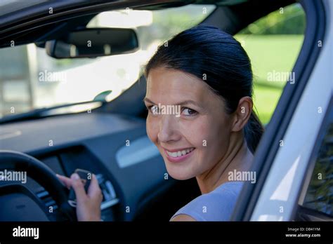 Brunette Attractive Woman And Her Car Stock Photo Alamy