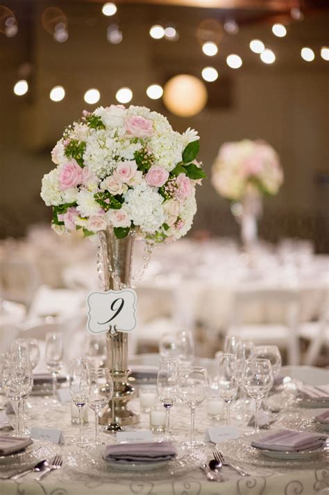 Wedding Centerpiece Using Tall Chic Silver Vase With Hanging Jewels