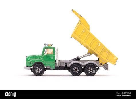 Dump truck toy isolated on white background Stock Photo - Alamy