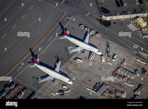 An Aerial View Of Two Delta Airlines Planes Waiting At Bostons Logan