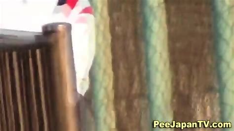 Asian Babe Caught Peeing