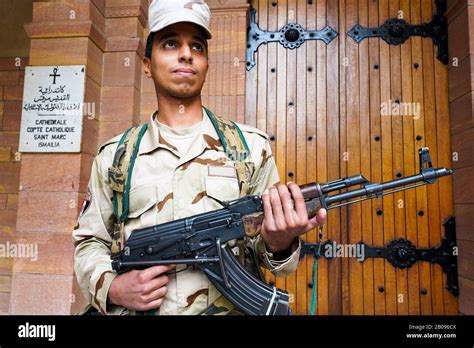 An armed soldier from the Egyptian Army guarding the Catholic cathedral ...