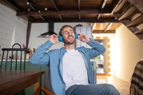 Premium Photo A Joyful Man Listening To His Favorite Music