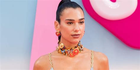 Dua Lipa Perches On A Rock In A Totally Naked Red Dress And Black Thong