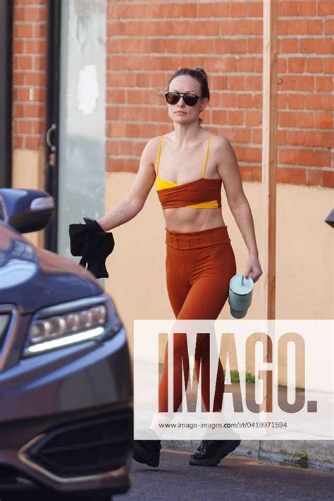 Olivia Wilde Shows Off Her Abs In A Red And Yellow Workout Ensemble As