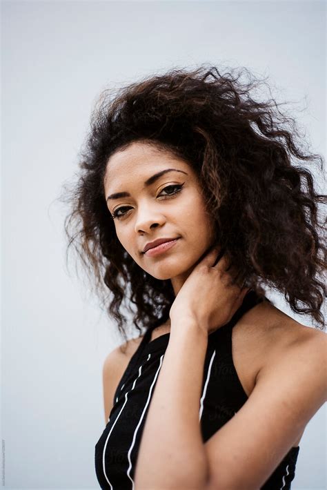 Mixed Race Young Woman With Curly Hair By Stocksy Contributor Jack