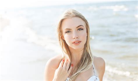 Premium Photo Happy Blonde Woman In Free Happiness Bliss On Ocean Beach Standing Straight And