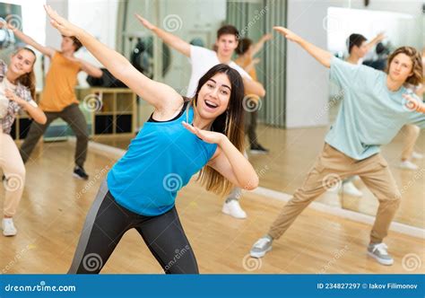 Happy Brunette Teenage Girl Practicing Vigorous Dance With Group Stock Image Image Of Greek