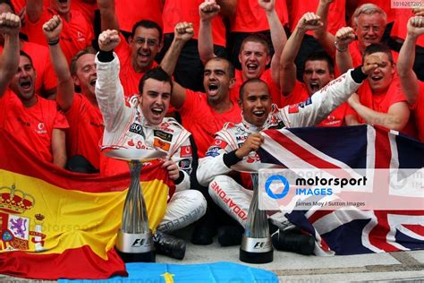 Race Winner Fernando Alonso ESP McLaren And Second Placed Team Mate