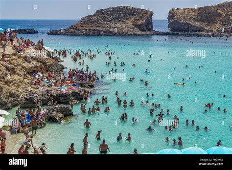 Comino Island, Malta tourists at the Blue Lagoon Stock Photo - Alamy