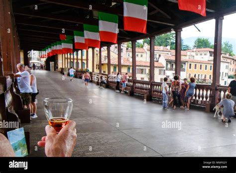 A Woman Is Drinking The Famous Mezzo E Mezzo Cocktail Of The Historic