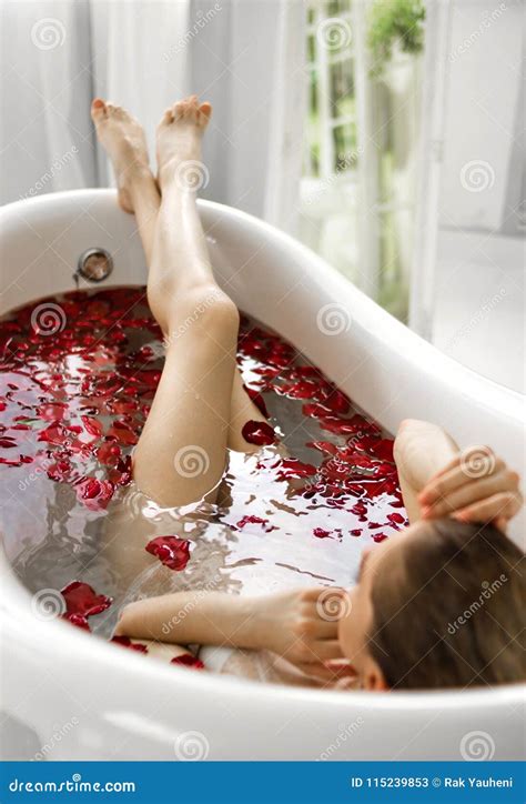 A Girl In A Bath With Rose Petals A Wellness Bath With Roses Stock