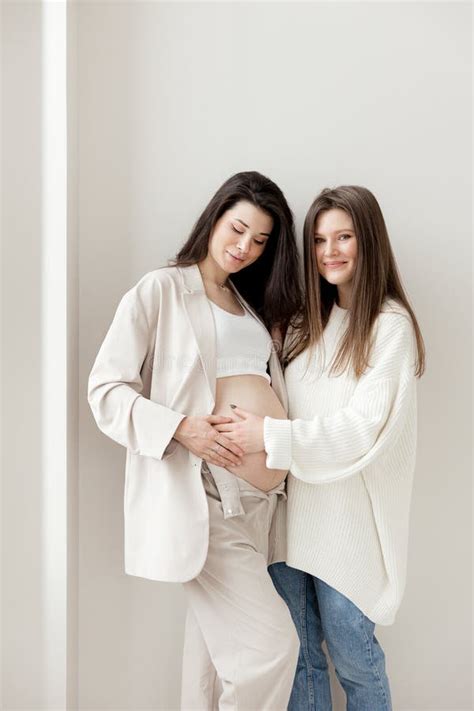 Stylish Pregnant Brunette Girl With Beige Trouser Suit And Friend Stock Image Image Of Birth