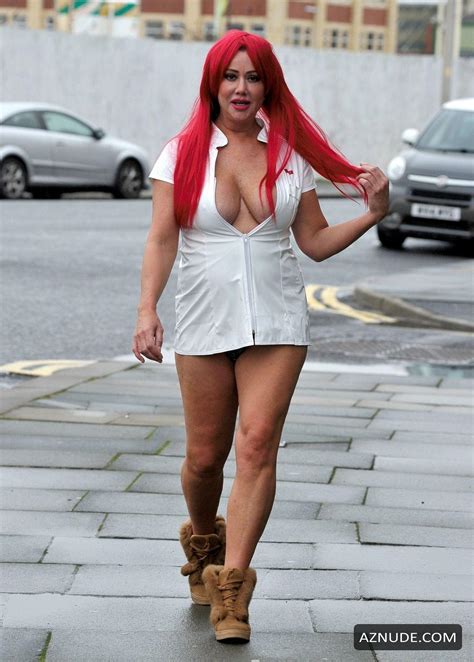 Lisa Appleton Sexy In A Red Wig For Local Sex Shop Saint And Sinners Photo Shoot In Blackpool
