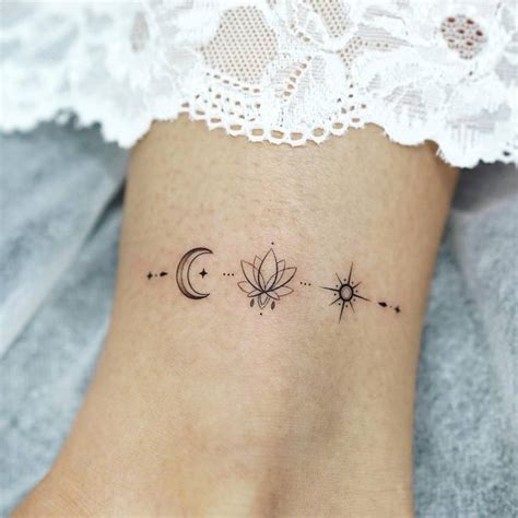 Fine Line Moon Lotus Flower And Star Tattoo Located On