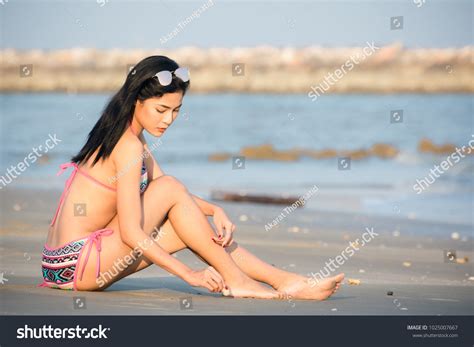 Beautiful Woman Sexy Bikini Sitting On Stock Photo 1025007667