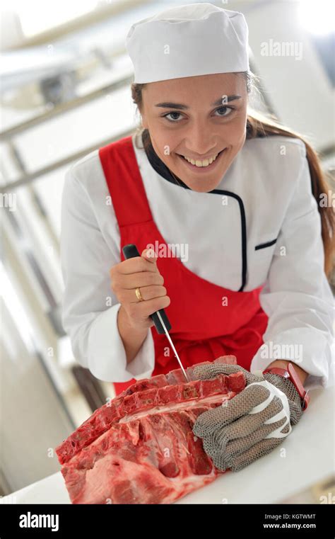 Smiling Young Butcher Girl At Work Stock Photo Alamy