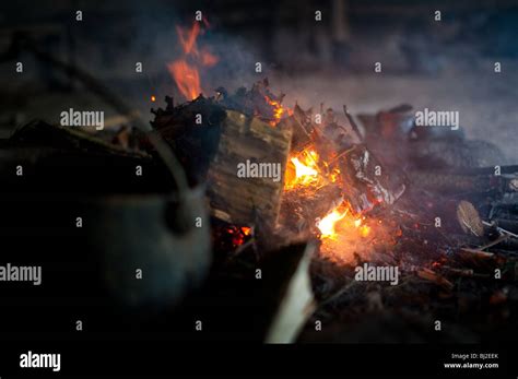 Old style cooking using iron age pots and a fire Stock Photo - Alamy