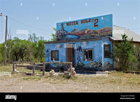 Water Hole #2 bar with a colorful mural painted on the front in Texola ...