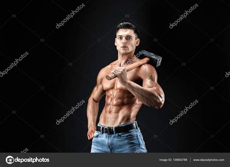 Muscular Man With Naked Torso Holding Big Hummer Isolated On Dark Grey Background Stock Photo