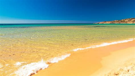 Spiaggia Su Giudeu Foto Come Arrivare E Hotel Nei Dintorni