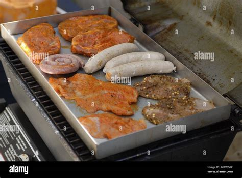 Bratwurst And Steaks On A Gas Grill Stock Photo Alamy