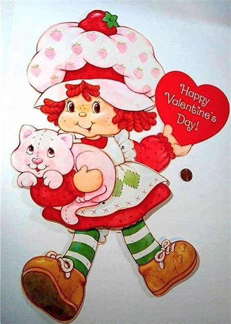 Strawberry Shortcake And Her Kitty Cat Custard As She Is Holding A Valentines Day Card For