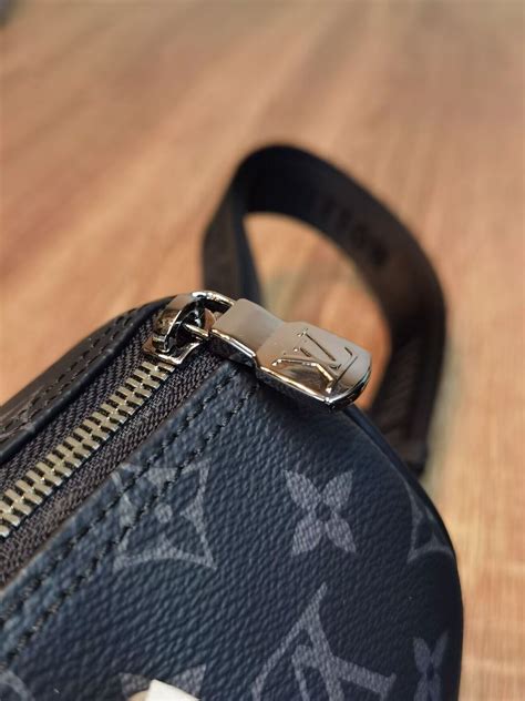 Louis Vuitton Lv 路易威登 老鼠版本m46271黑花 本款 Keepall 25 手袋取材 Monogram Eclipse