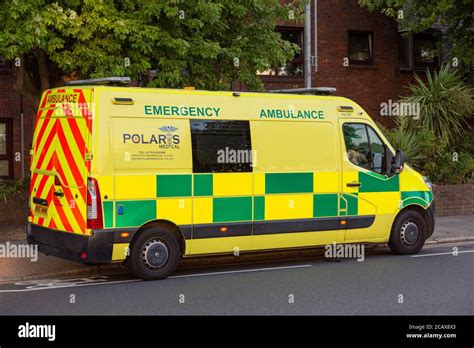 A British Emergency Ambulance Parked On The Side Of The Road Stock