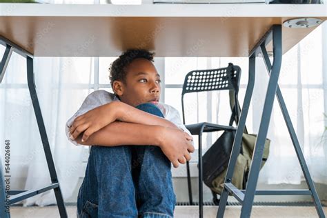 Boy Hiding Under Table At Home Stock Photo Adobe Stock