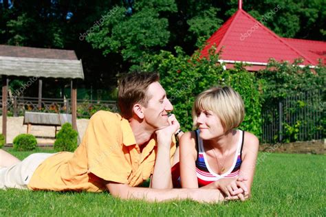 Young couple laying on grass — Stock Photo © volare2004 #12608585