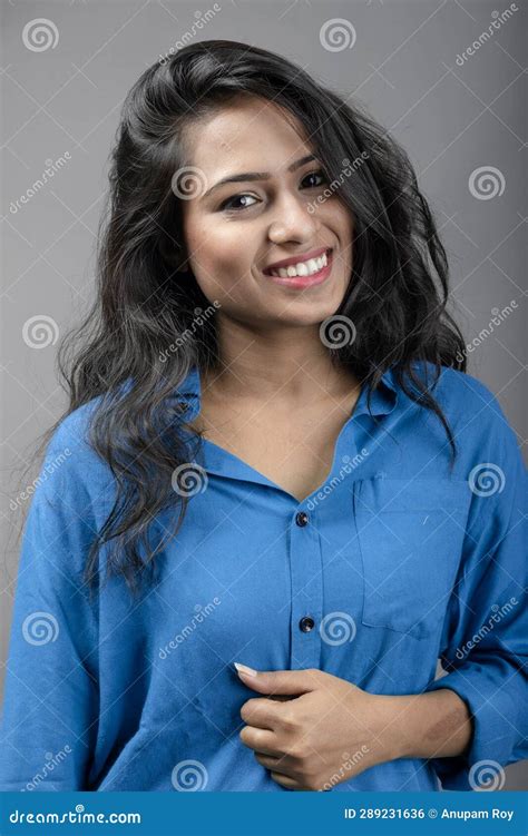 Indian Female Young Model In Casual Wear Against Grey Background