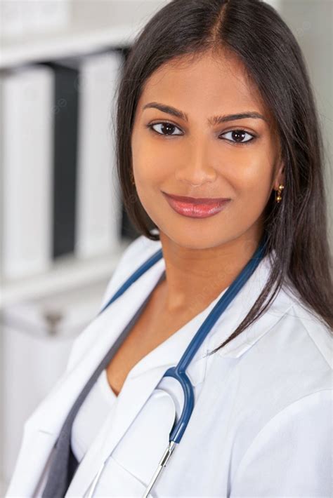 Portrait Of Indian Asian Female Medical Doctor In A Hospital Office