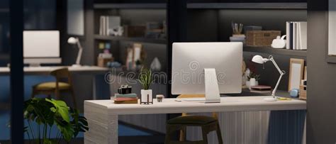 Office Desk Workspace At Night In Modern Interior Style Stock