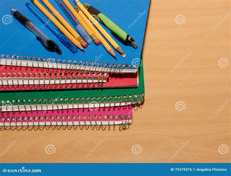 Stacked Notebooks With Pens And Pencils Stock Photo Image Of Notes