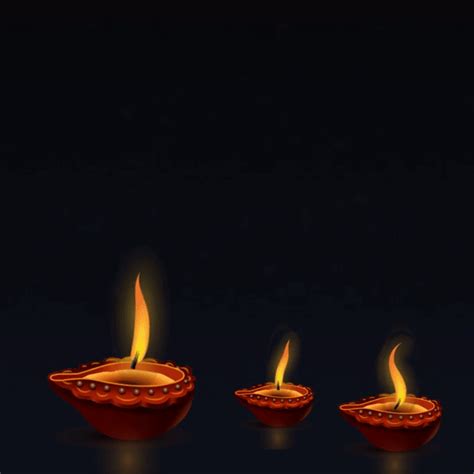 Three Lit Candles Sitting On Top Of A Black Table Next To An Orange