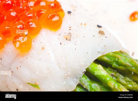 Asparagus With Fish And Red Caviar In Creamy Sauce Stock Photo Alamy