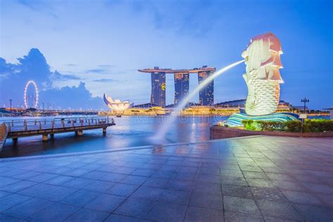 The Merlion And Marina Bay Sands In City Center Of Singapore Editorial