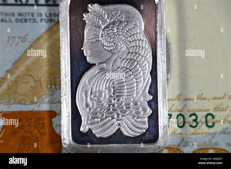 USD American 100 dollars cash money and silver precious metal ounce bar of pure silver, The ...