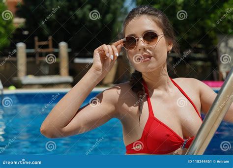 Woman In Swimming Pool In Sunglasses Stock Image Image Of Pool Resting 118244451