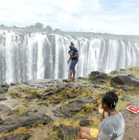 Tourist pictured near edge of Victoria Falls in Zimbabwe seconds before ...